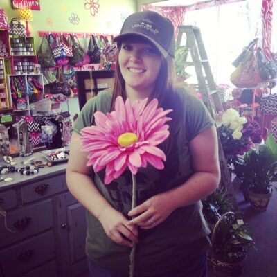 Each of the girls in the line carried giant gerbera daisies in different colors.